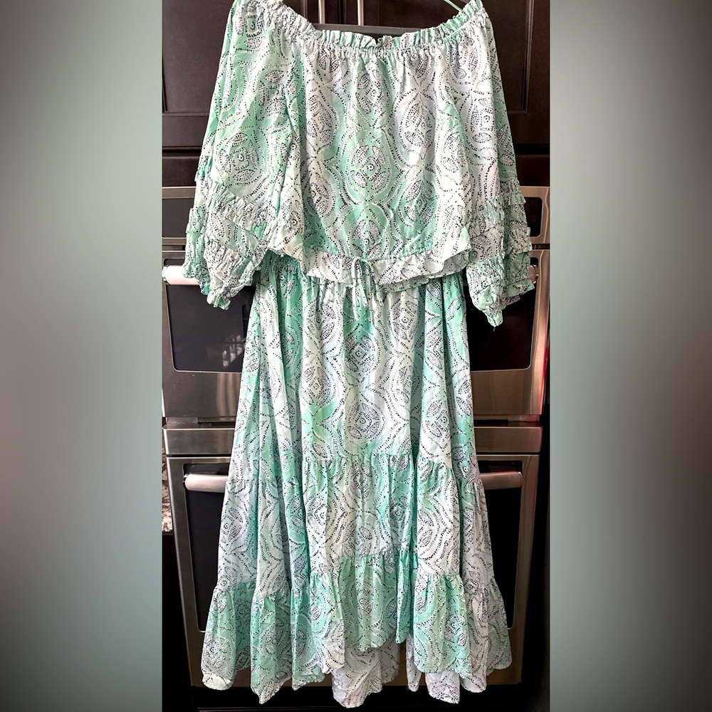 Two piece ensemble with cropped blouse and matching long skirt.